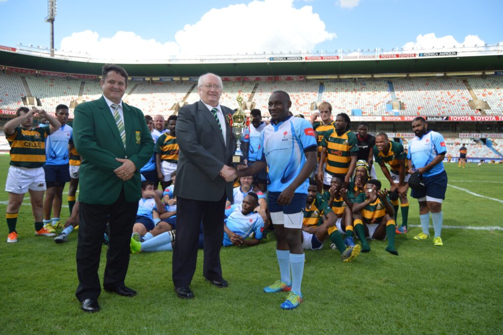 The 2019 Stones Cup is handed over to the captain of the Blue Bulls Deaf Rugby squad, Patrick Molotshwa